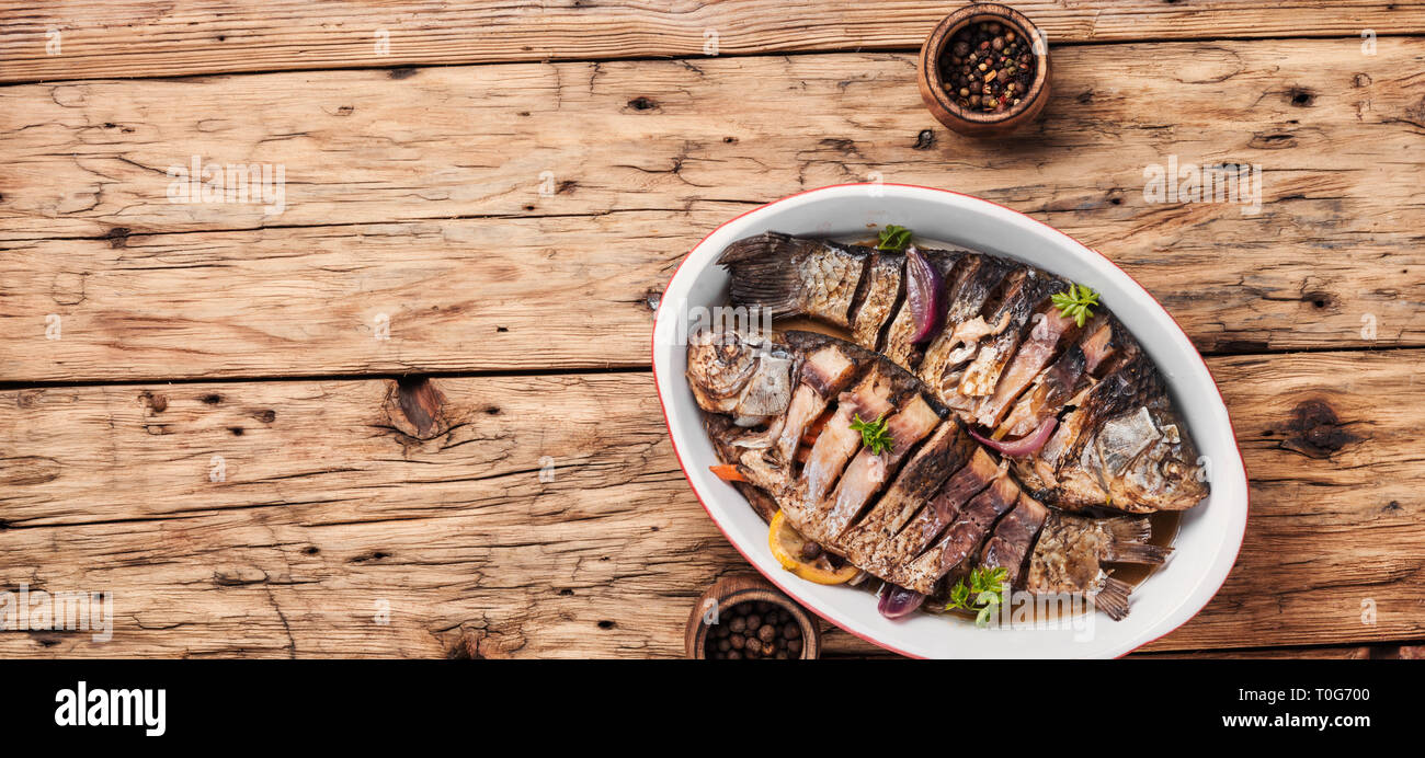 Loaded Fish Baked fish loaded with citrus, herbs and spices in baked fish Stock ...