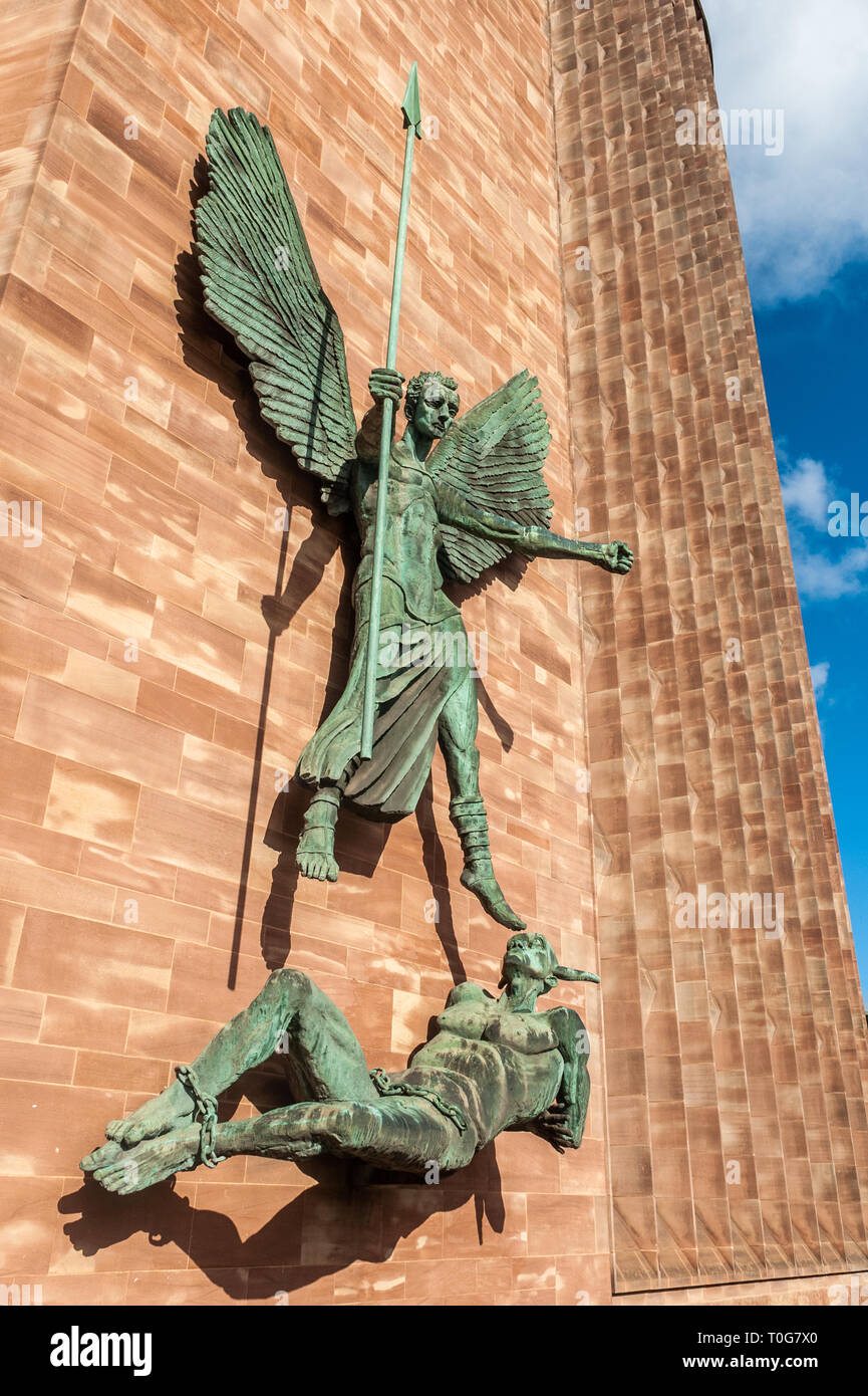 St. Michael stands over the devil at Coventry Cathedral, Coventry, West Midlands, UK. Stock Photo