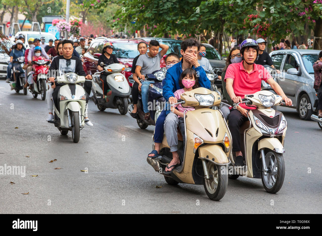 Family riding on a motorcycle, Hanoi, Vietnam, Asia Stock Photo