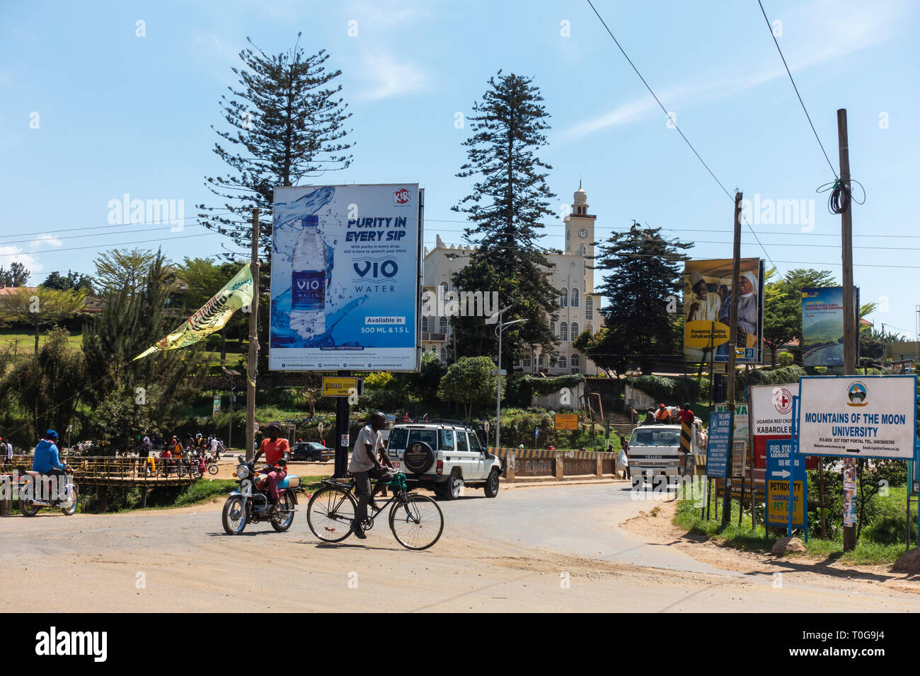 Busy intersection with Indian mosque in background in town centre of Fort Portal in South West Uganda, East Africa Stock Photo