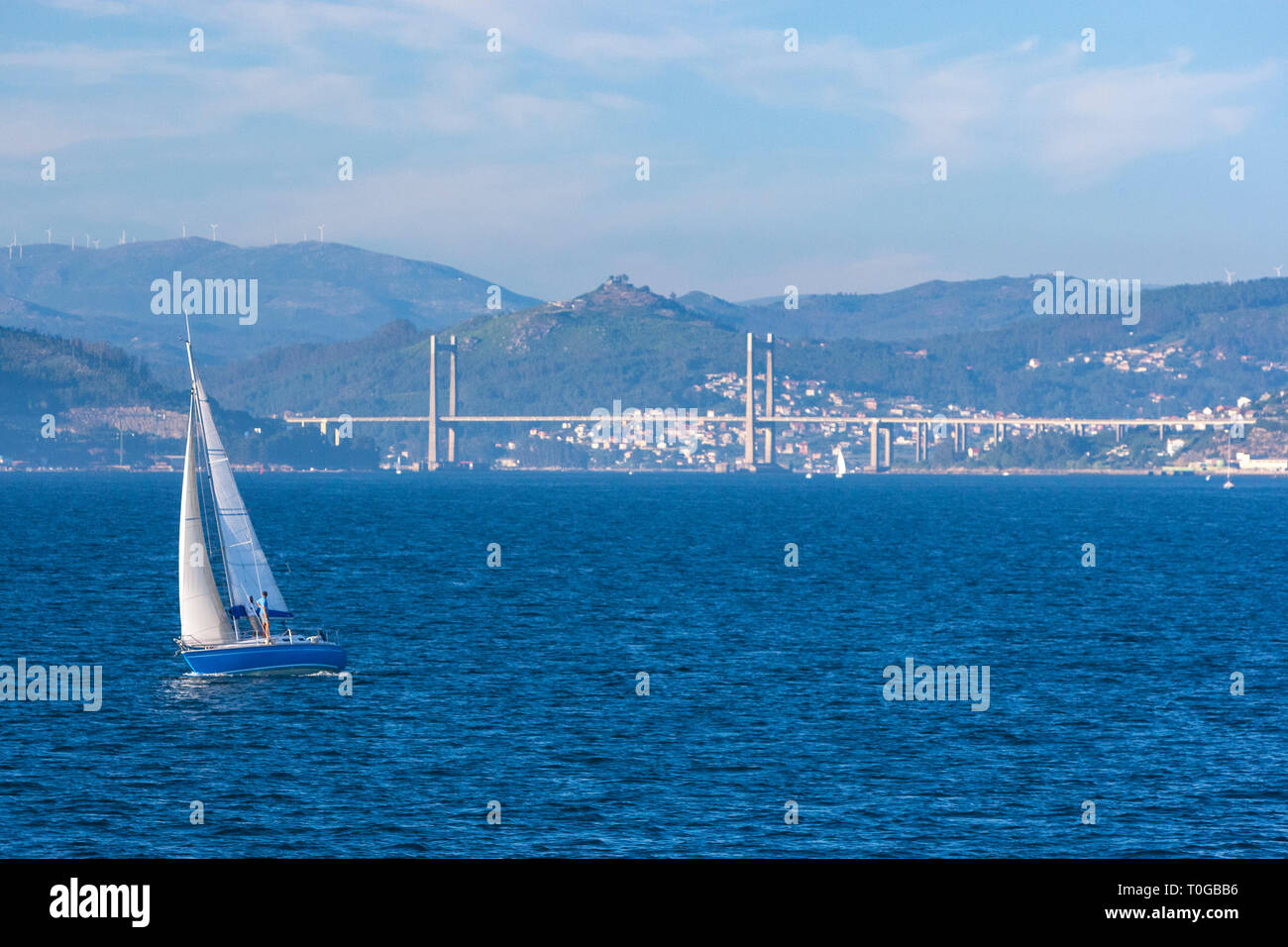 Sailing boat with the Rande Bridge at the background, Ria de Vigo