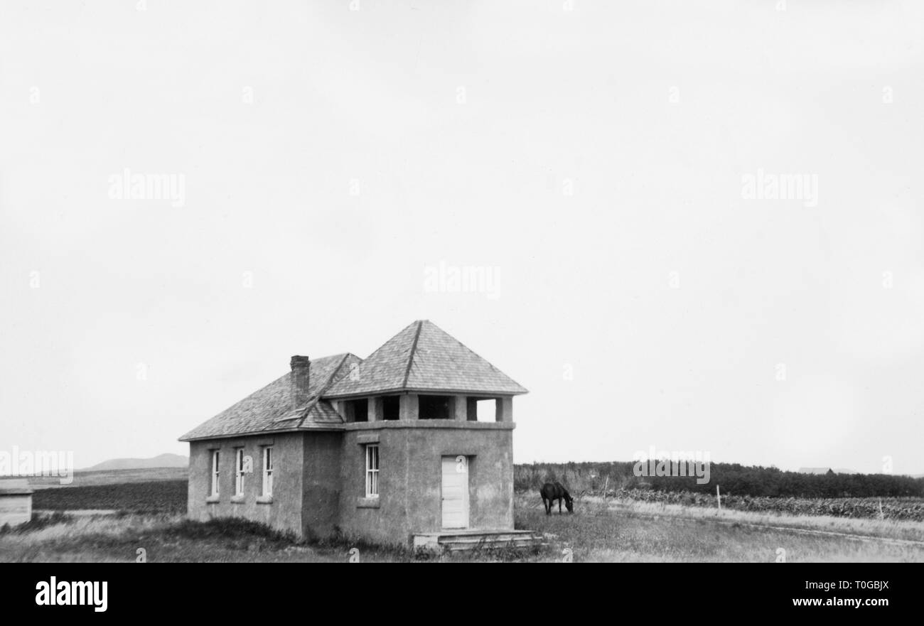 One room schoolhouse in Montana, ca. 1920. Stock Photo