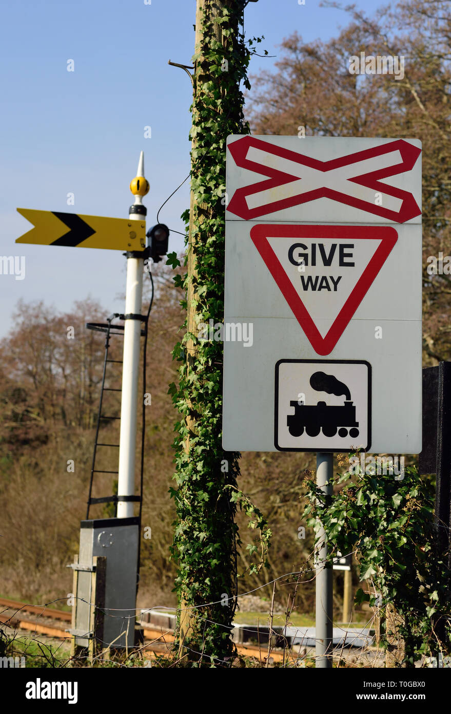 A give way sign and distant signal at an ungated level crossing on a ...