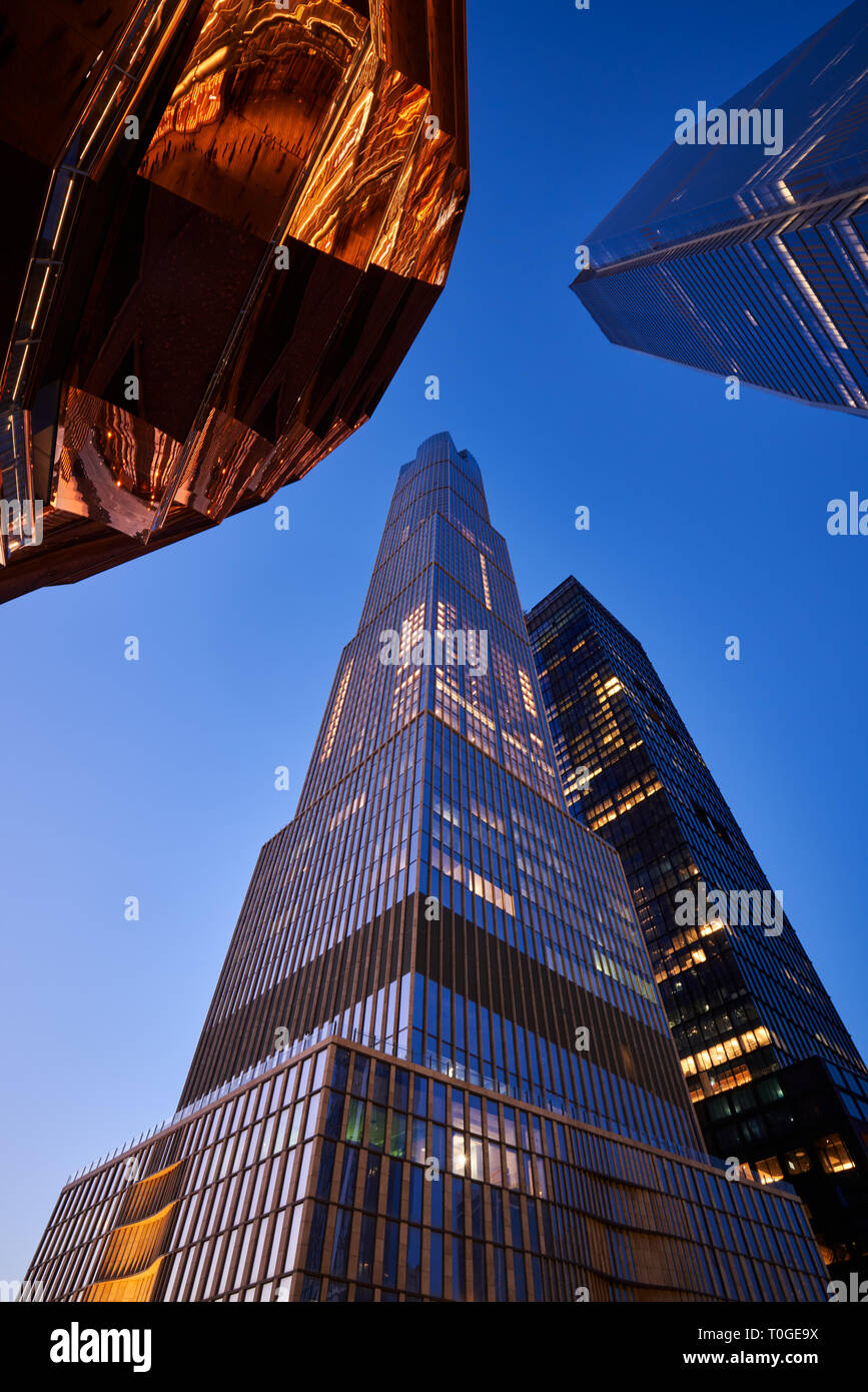 15 Hudson Yards skyscraper with part of The Vessel staircase at dusk. Midtown Manhattan West. Stock Photo