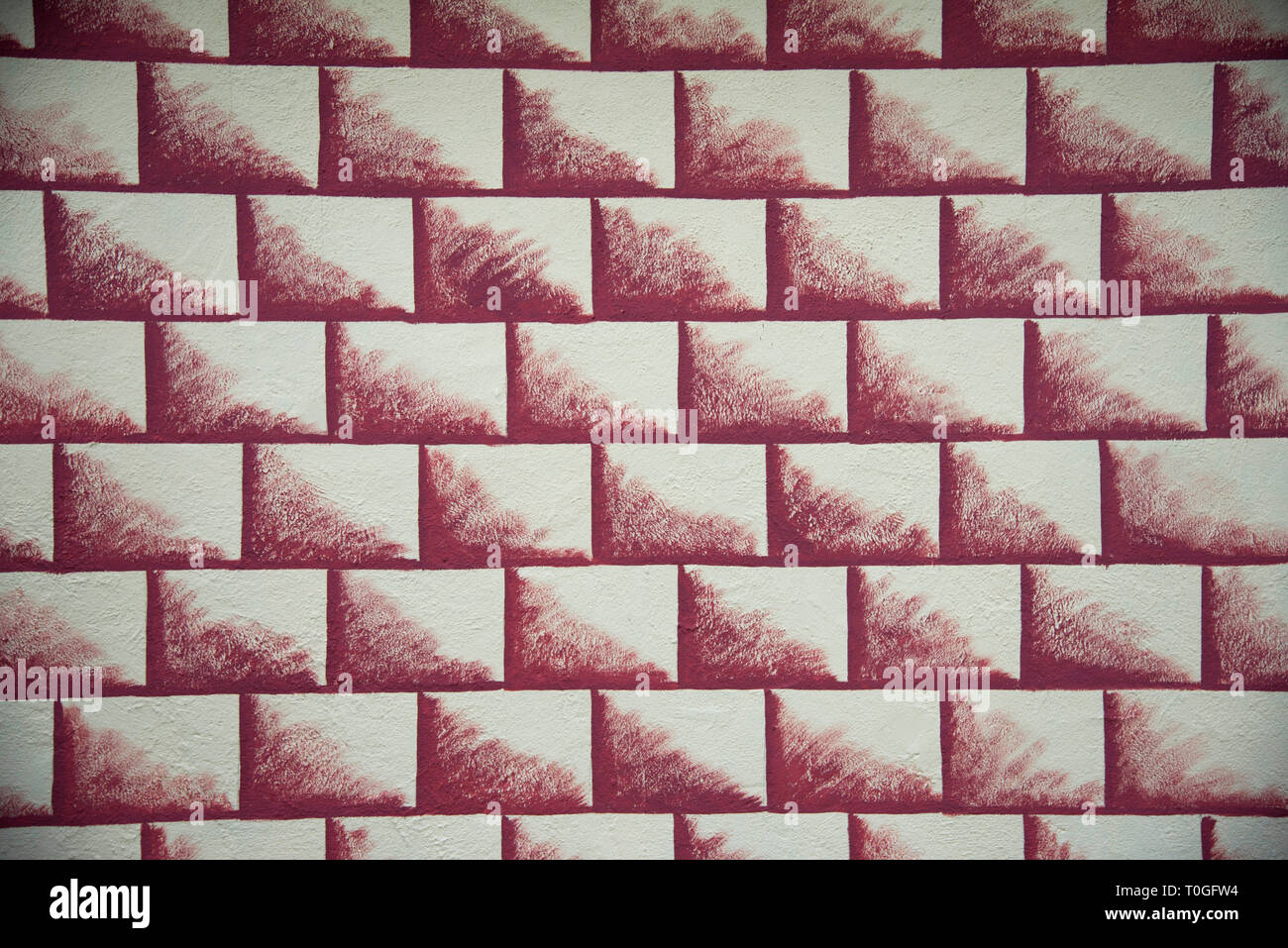 Bricks graphic in brown colour painted on wall. Stock Photo