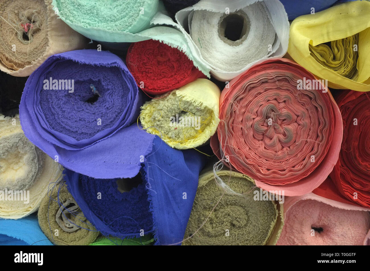 Colorful roll fabric background Stock Photo - Alamy