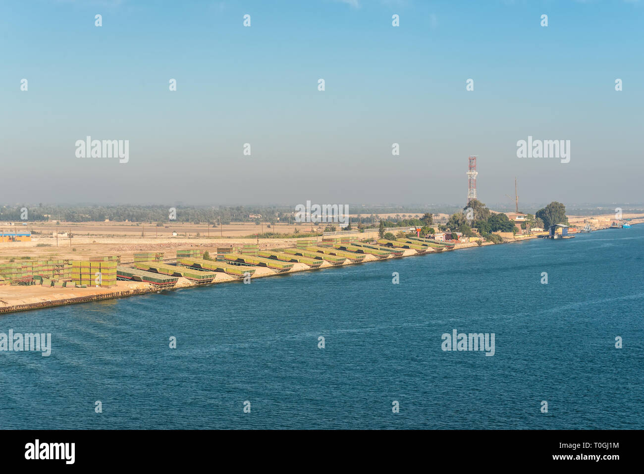 El Qantara, Egypt - November 5, 2017: Pontoons bridge for crossing the Suez Canal lie on the shore of canal near El Qantara, Egypt. Stock Photo