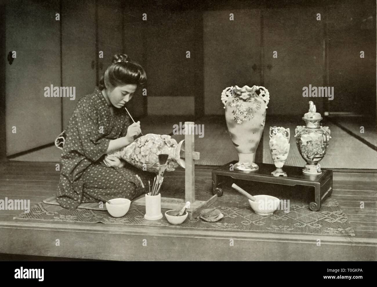 'Painting Pottery for Export', 1910. Creator: Herbert Ponting. Stock Photo