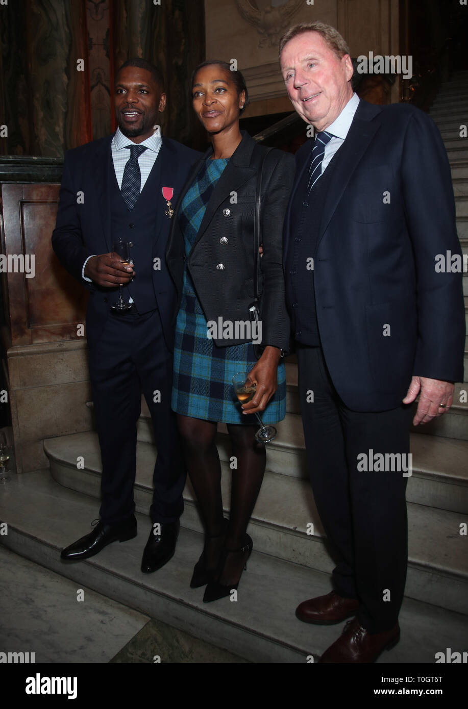 Dr Mark Prince OBE (left) with his wife Daszine, and Harry 