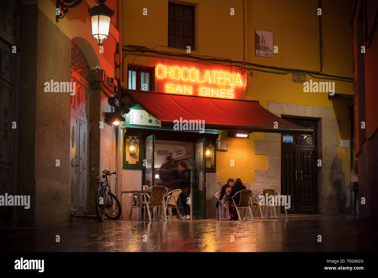 The chocolatería San Ginés is a famous café in central Madrid. Image taken from Pasadizo de San Gines. Stock Photo