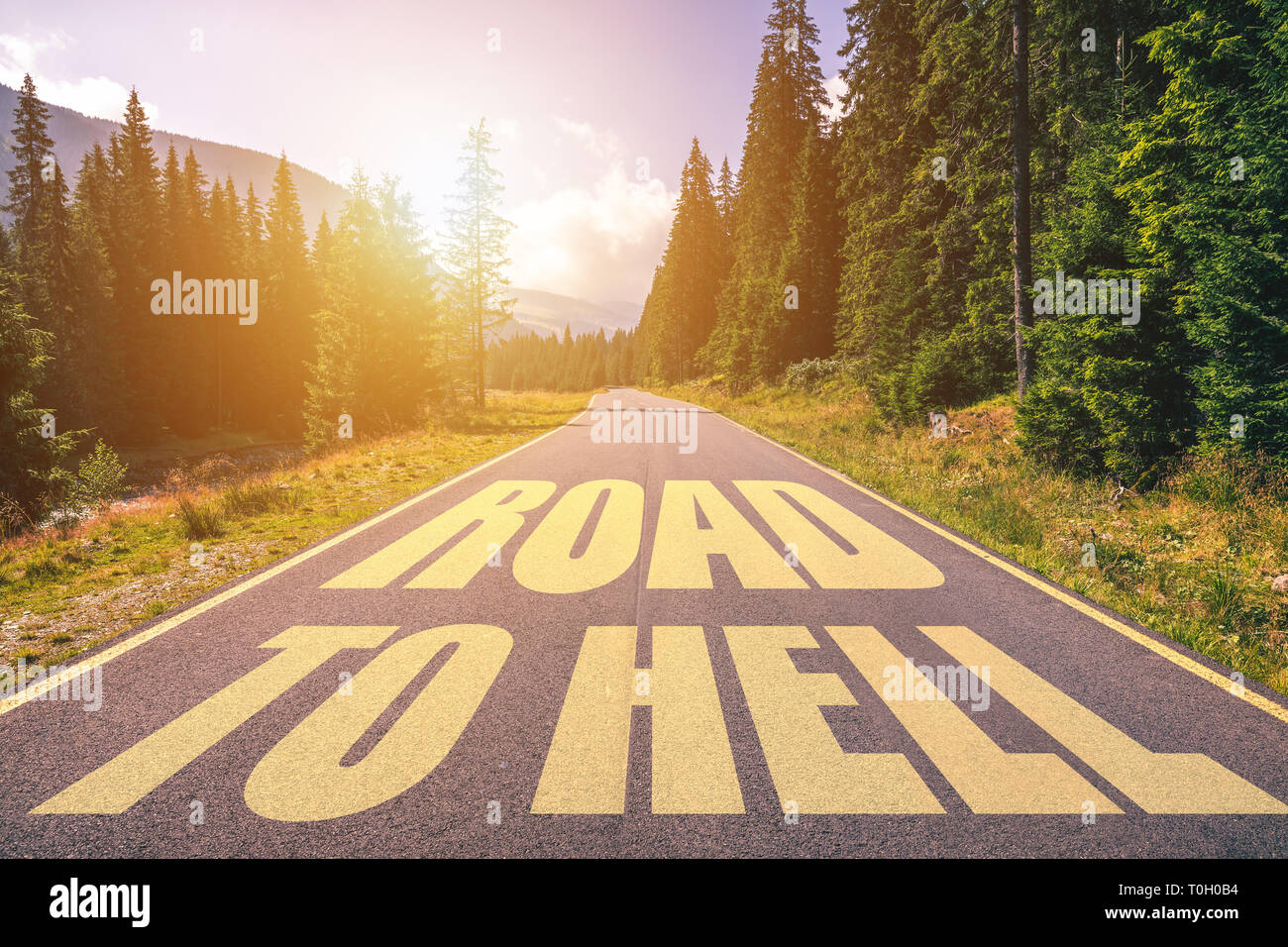 Road to hell written on the street in the mountains. Road to hell text ...