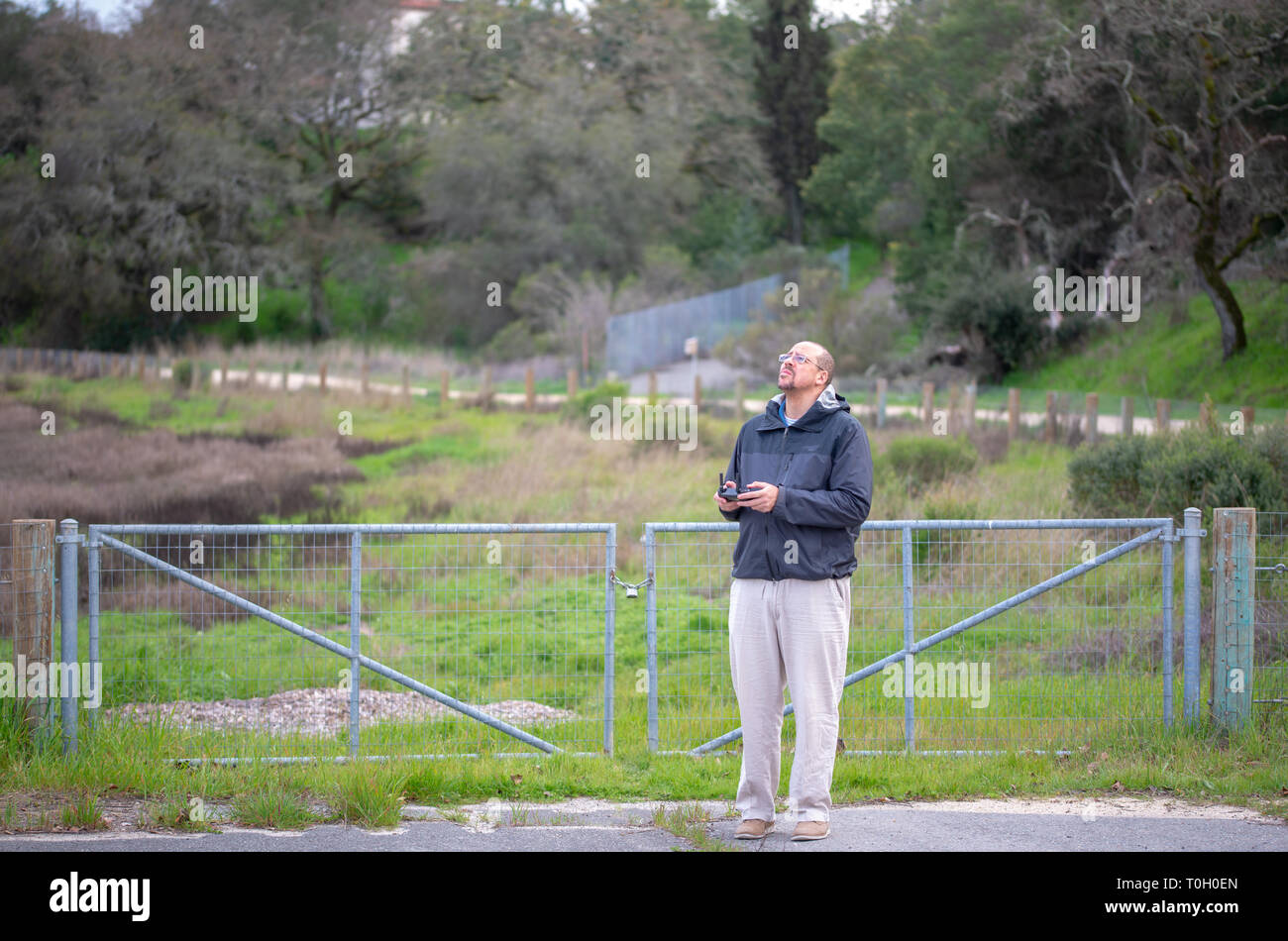 Man flying drone with remote control Stock Photo