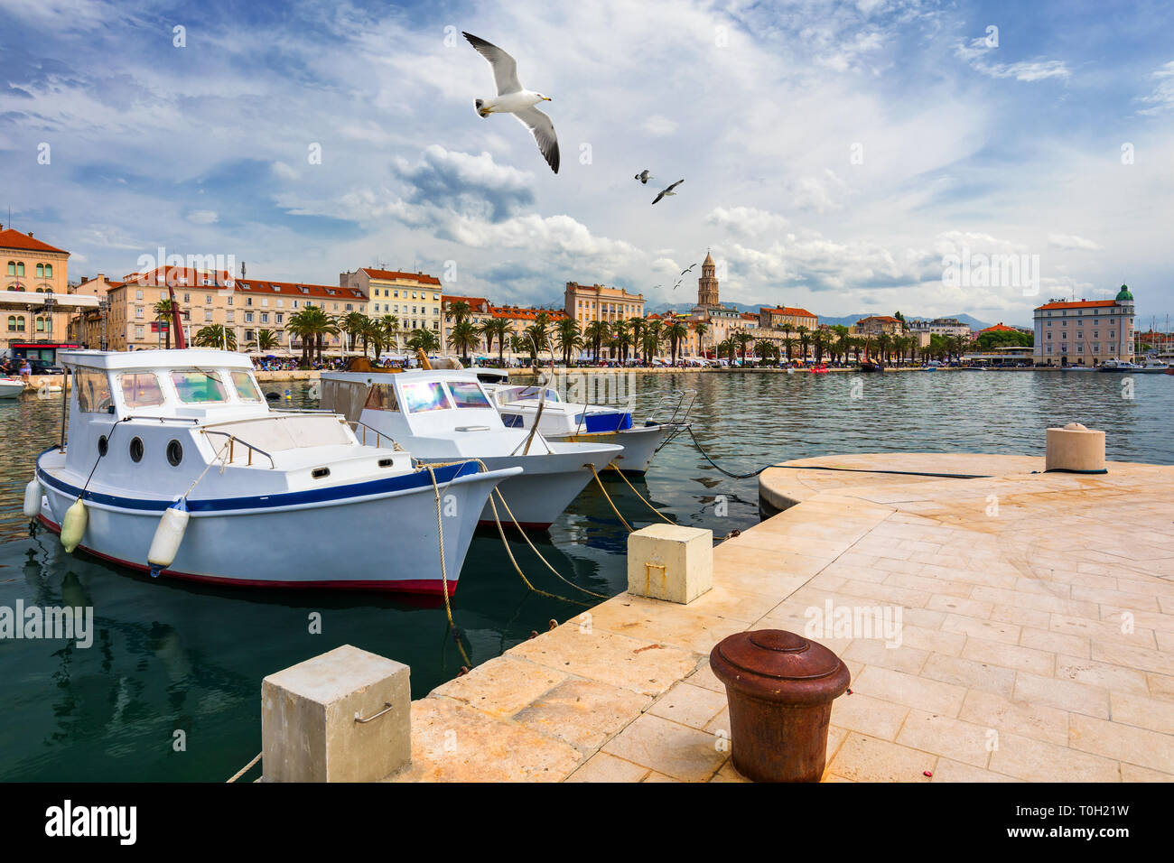 City of Split with colorful fishing boats in harbor, Dalmatia, Croatia. Waterfront view of fishing boats at mediterranean scenery in old roman town Sp Stock Photo