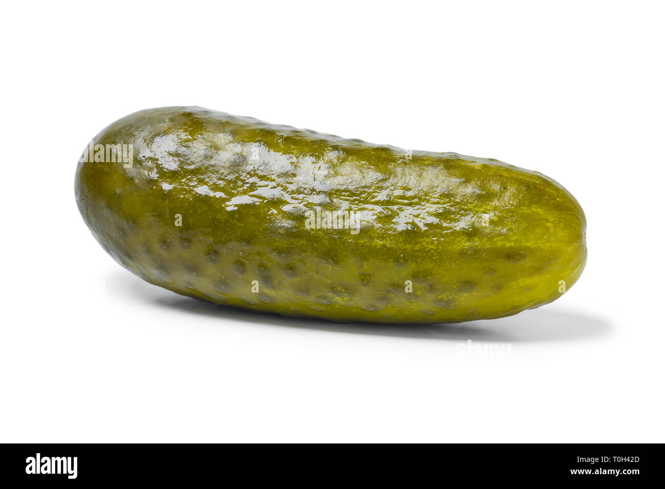 Whole single pickled gherkin isolated on white background Stock Photo