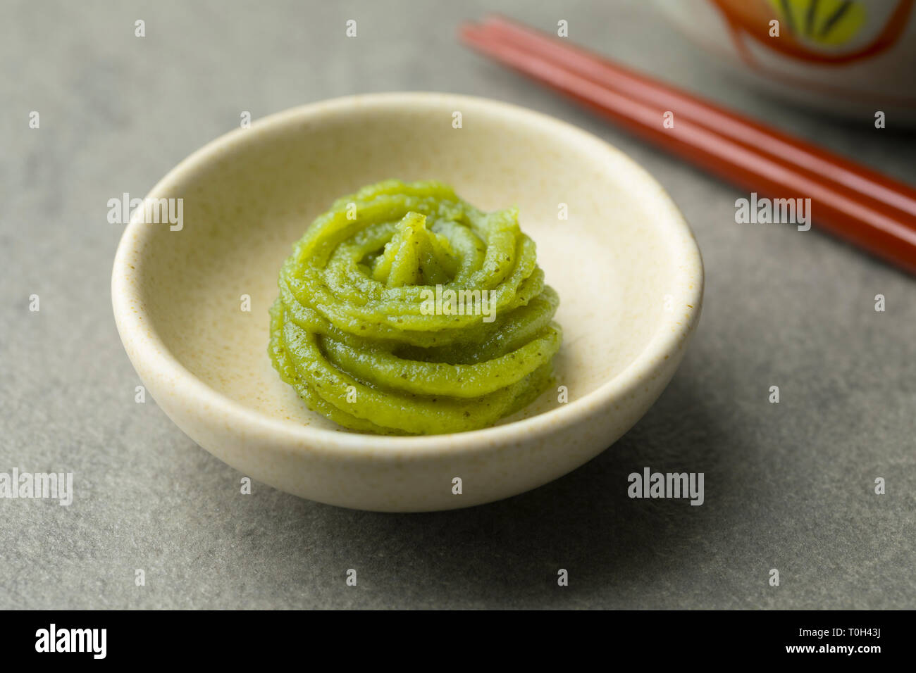 Bowl with traditional Japanese horseradish paste close up Stock Photo