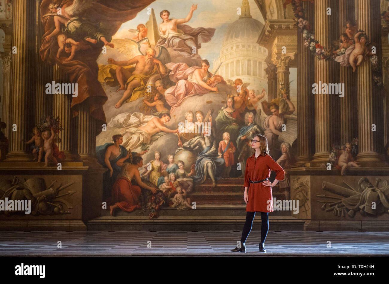 A visitor views Greenwich's Painted Hall at the Old Royal Naval College in London, before it reopens to the public on March 23 following a two-year National Lottery funded conservation project. Stock Photo
