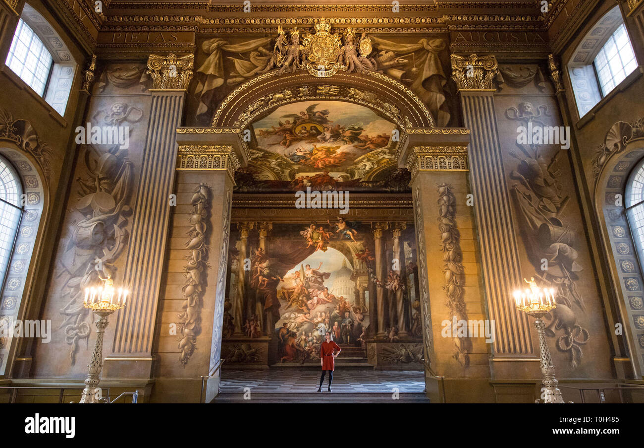 A visitor views Greenwich's Painted Hall at the Old Royal Naval College in London, before it reopens to the public on March 23 following a two-year National Lottery funded conservation project. Stock Photo