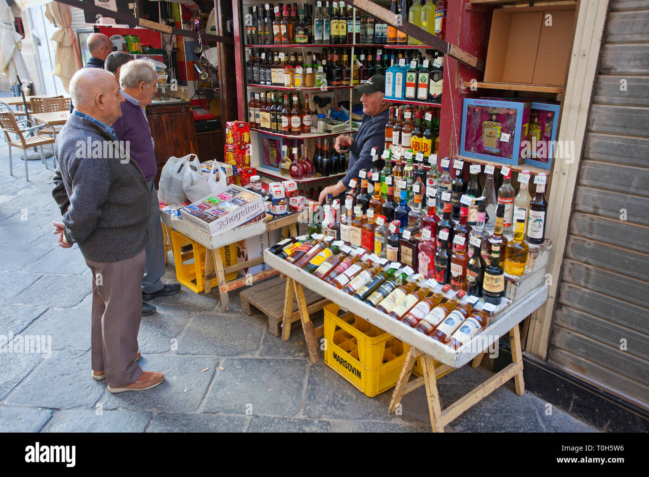 Selling alcohol from a small liquor shop, Valletta, Malta Stock Photo