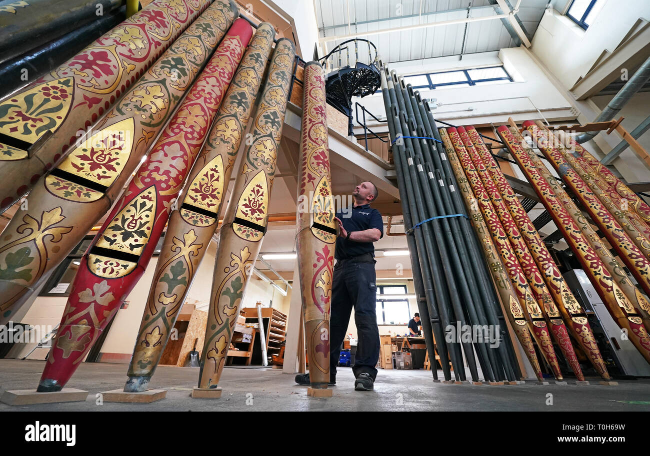 Technician Jim Reeves, from organ specialists Harrison and Harrison in Durham, looks at one of nearly 5,403 pipes removed from York Minster's Grand Organ, which will be repaired or refurbished at their workshop in Durham. Stock Photo