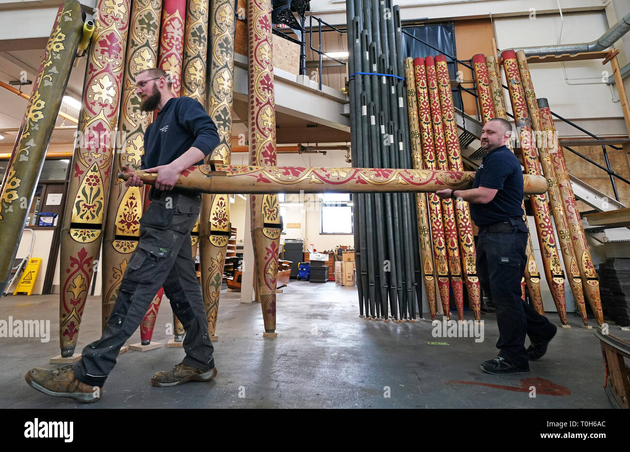 Technicians Jim Reeves 38 (right) and Tom Hobbs, 23, from organ specialists Harrison and Harrison in Durham, carry one of almost 5,403 pipes removed from York Minster's Grand Organ, which will be repaired or refurbished at their workshop in Durham. Stock Photo