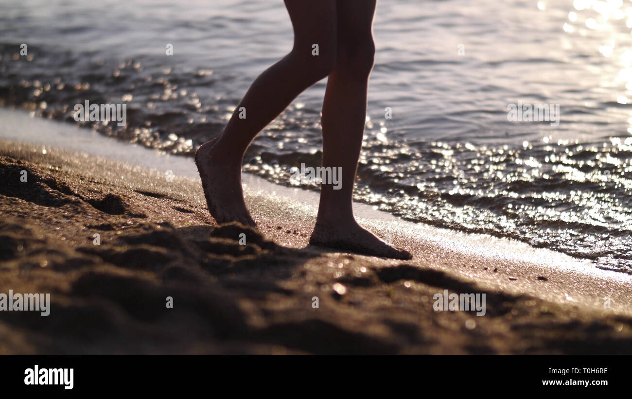 Male feet walking on sand hi-res stock photography and images - Alamy