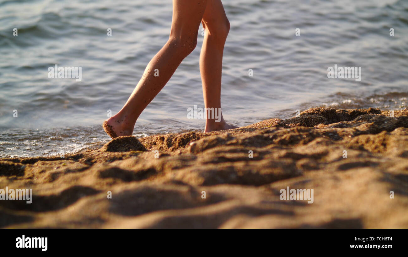 Male feet walking on sand hi-res stock photography and images - Alamy