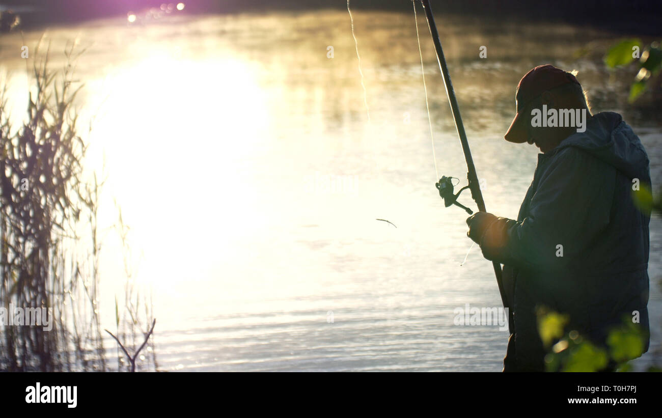 Man Getting Fish Dark man fishing with moon hi-res stock photography and images - Alamy