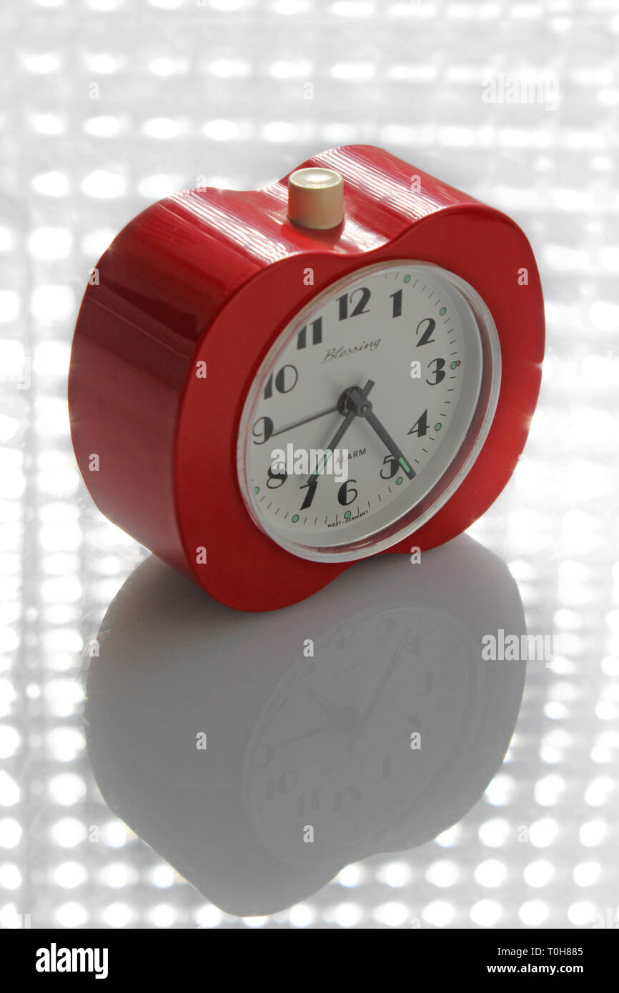 Vintage alarm clock apple inspired, isolated on white background, close