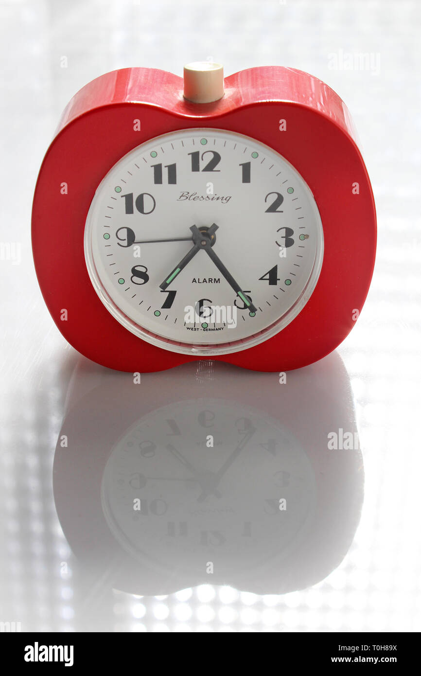 Vintage alarm clock apple inspired, isolated on white background, close