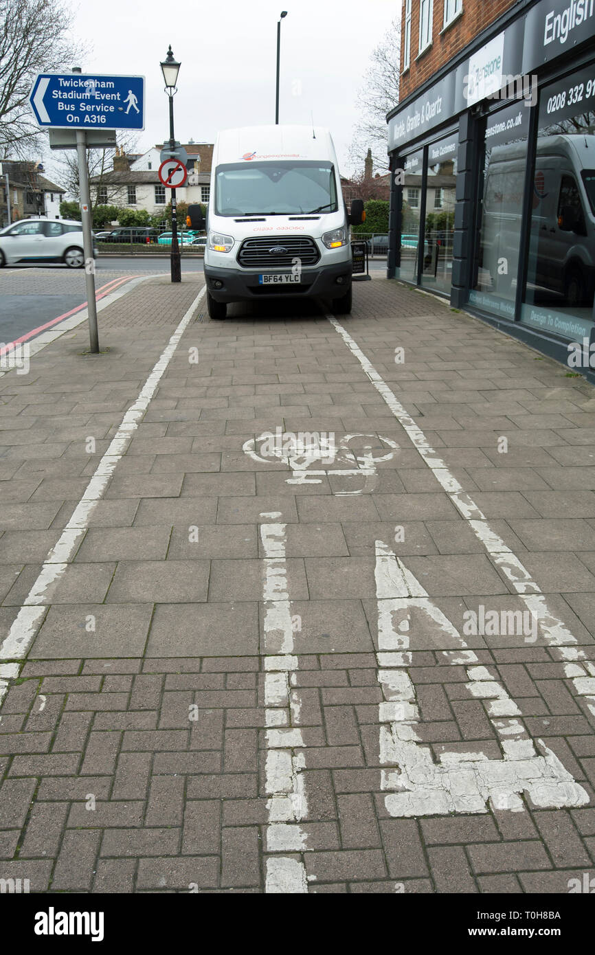 van parked in cycle lane marked on footway in richmond, surrey, england Stock Photo