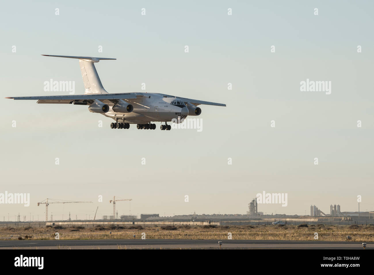 An Ilyushin Il-76 prepares to land at Ali Al Salem Air Base, Kuwait, March 11, 2019. The U.S. Air Forces Central Command’s Air Mobility Division and Airlift Control Team orchestrate the utilization of commercial international heavyweight air tenders to move theater cargo providing the USCENTCOM theater an important airlift capability for cargo that cannot be load planned on military aircraft within the next 72 hours. This is the first time in more than two years the capability has been used at ASAB. (U.S. Air Force Photo/Tech. Sgt. Robert Cloys) Stock Photo