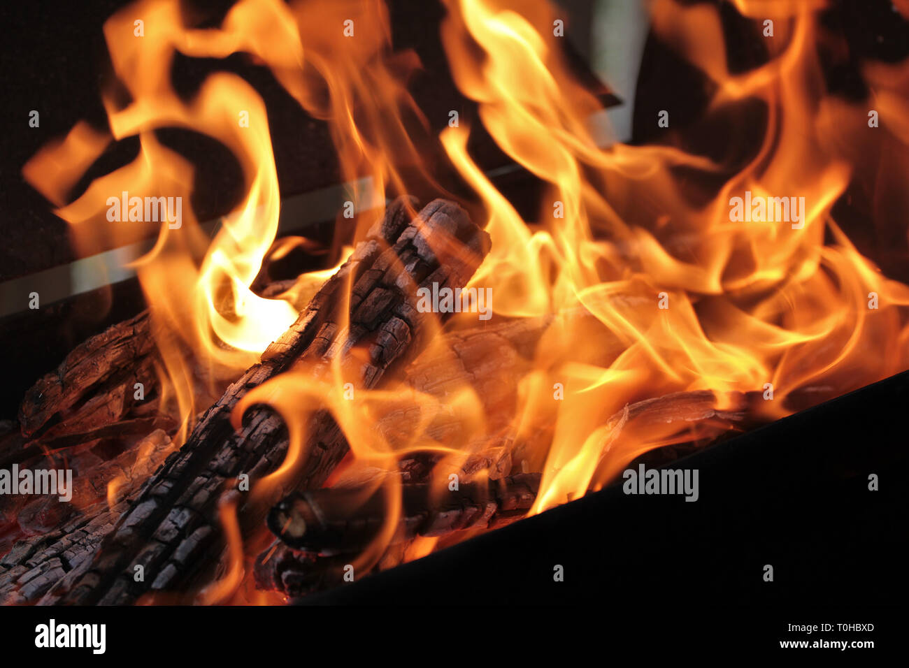 A Shot Of Burning Firewood In The Fireplace Close Up Burning