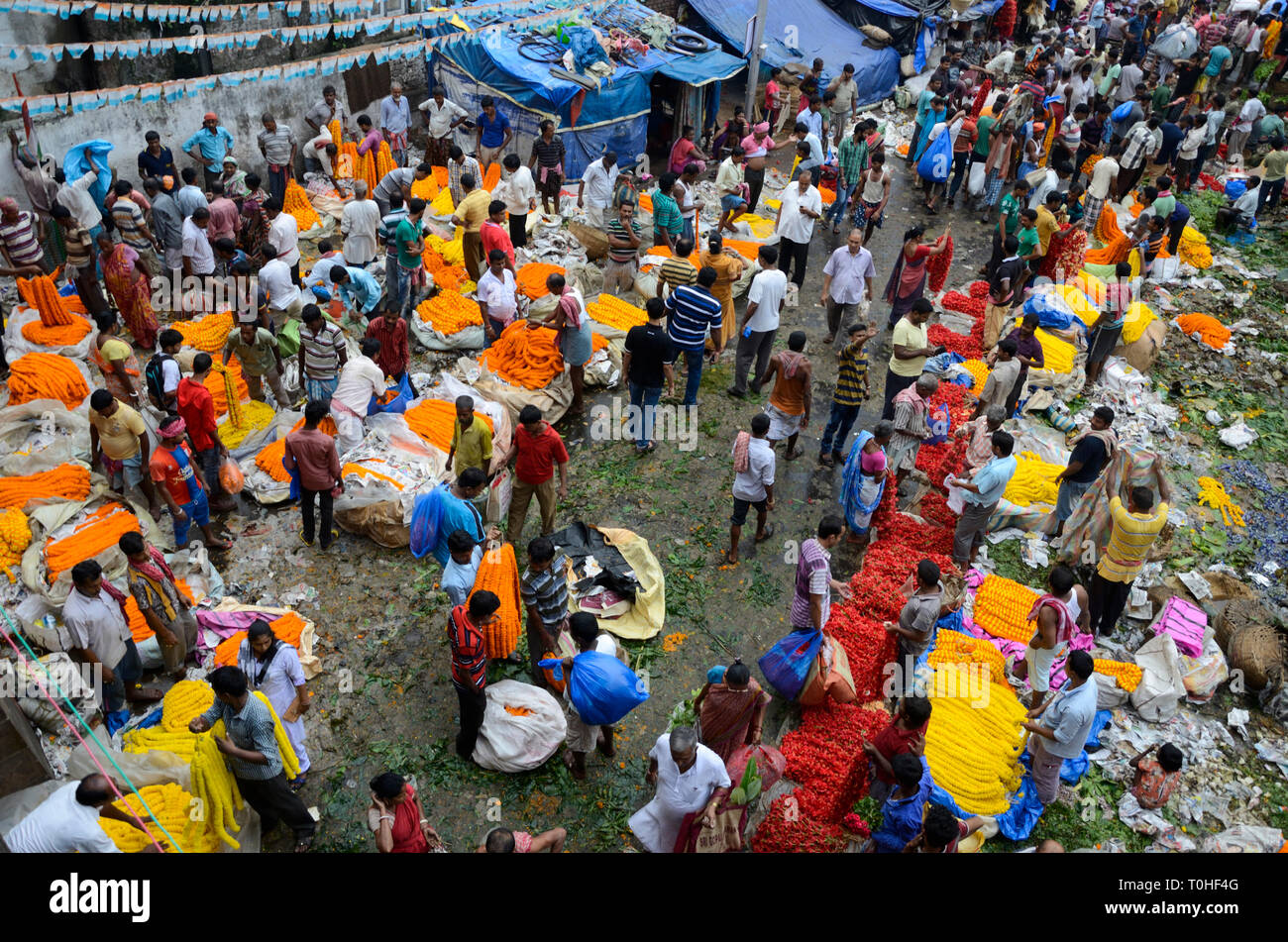 Men buying garlands in flower market, Kolkata, West Bengal, India, Asia Stock Photo