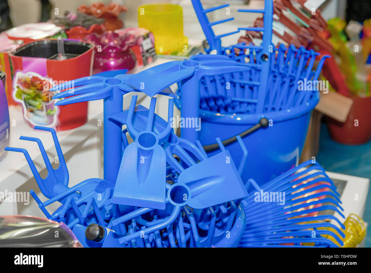 Blue rake Plastic products, plant care products in a supermarket