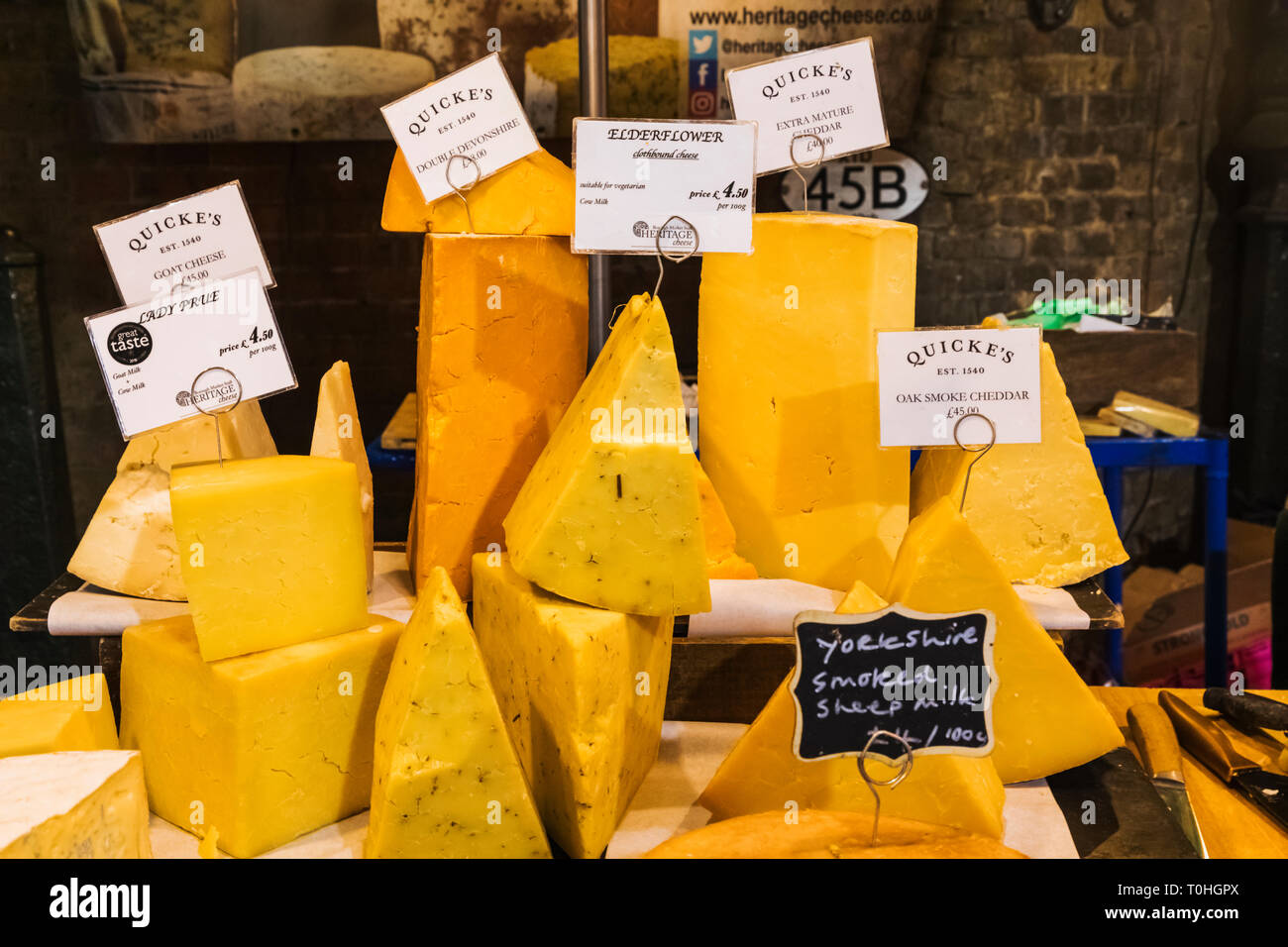 England, London, Southwark, London Bridge City, Borough Market, Cheese Shop Display Cheeses Stock Photo
