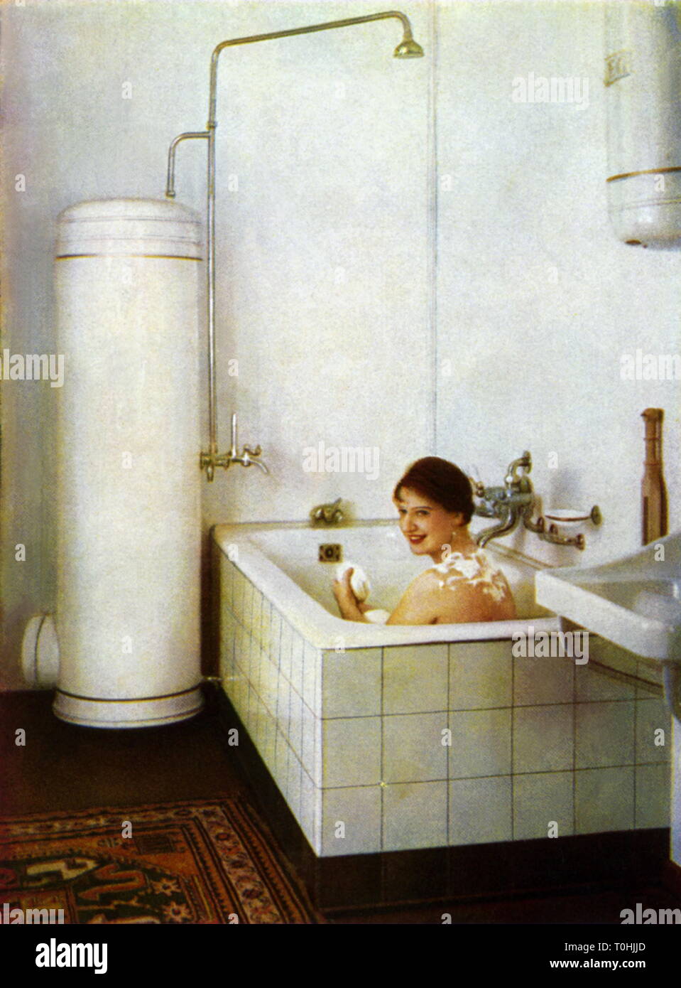 household, bathwater heater by AEG supply warm water, starlet and actress Lantelme Durrer in the bathtub, advertising postcard, Germany, circa 1929, Additional-Rights-Clearance-Info-Not-Available Stock Photo