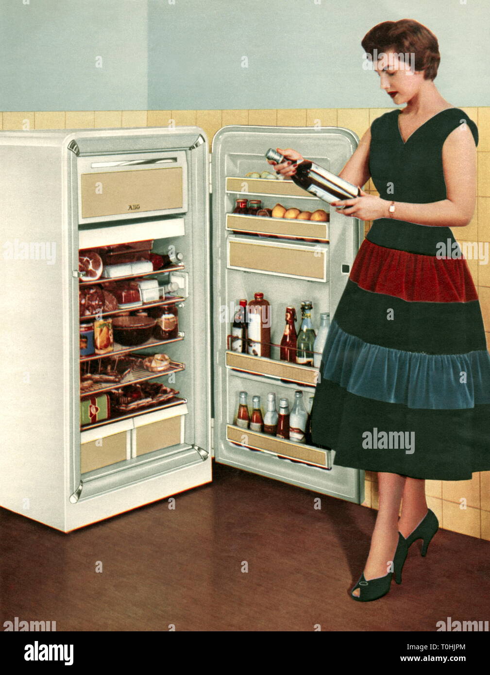 household, housewife at refrigerator, advertising, AEG, Germany, 1957, Additional-Rights-Clearance-Info-Not-Available Stock Photo