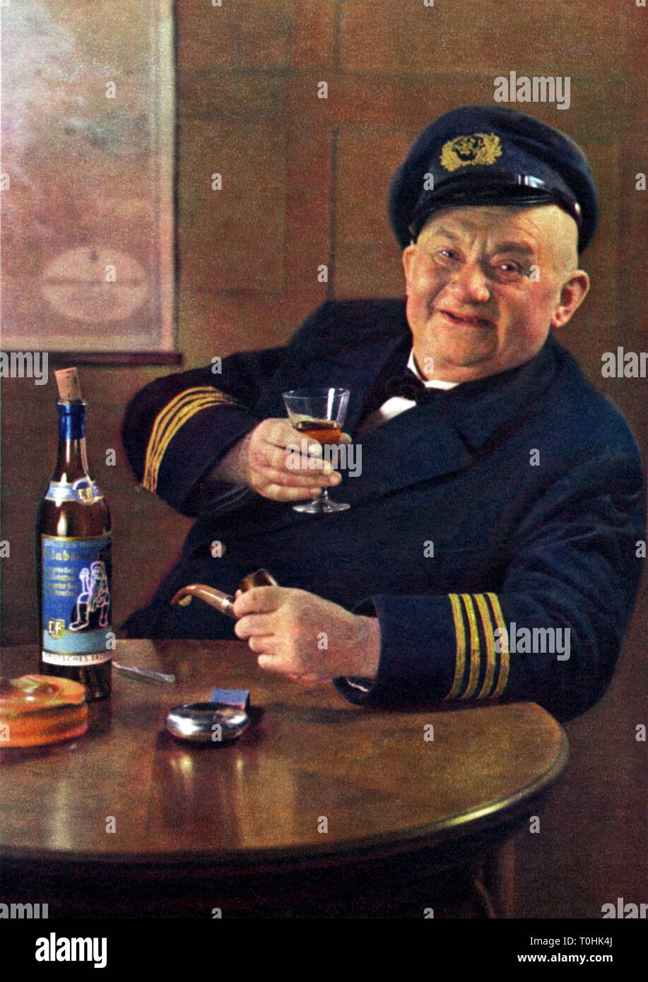 advertising, alcohol, seabear is drinking a glass of Klabautermann, Jamaica Rum, blend, bottle on the table, Germany, Bremen, circa 1930, Additional-Rights-Clearance-Info-Not-Available Stock Photo