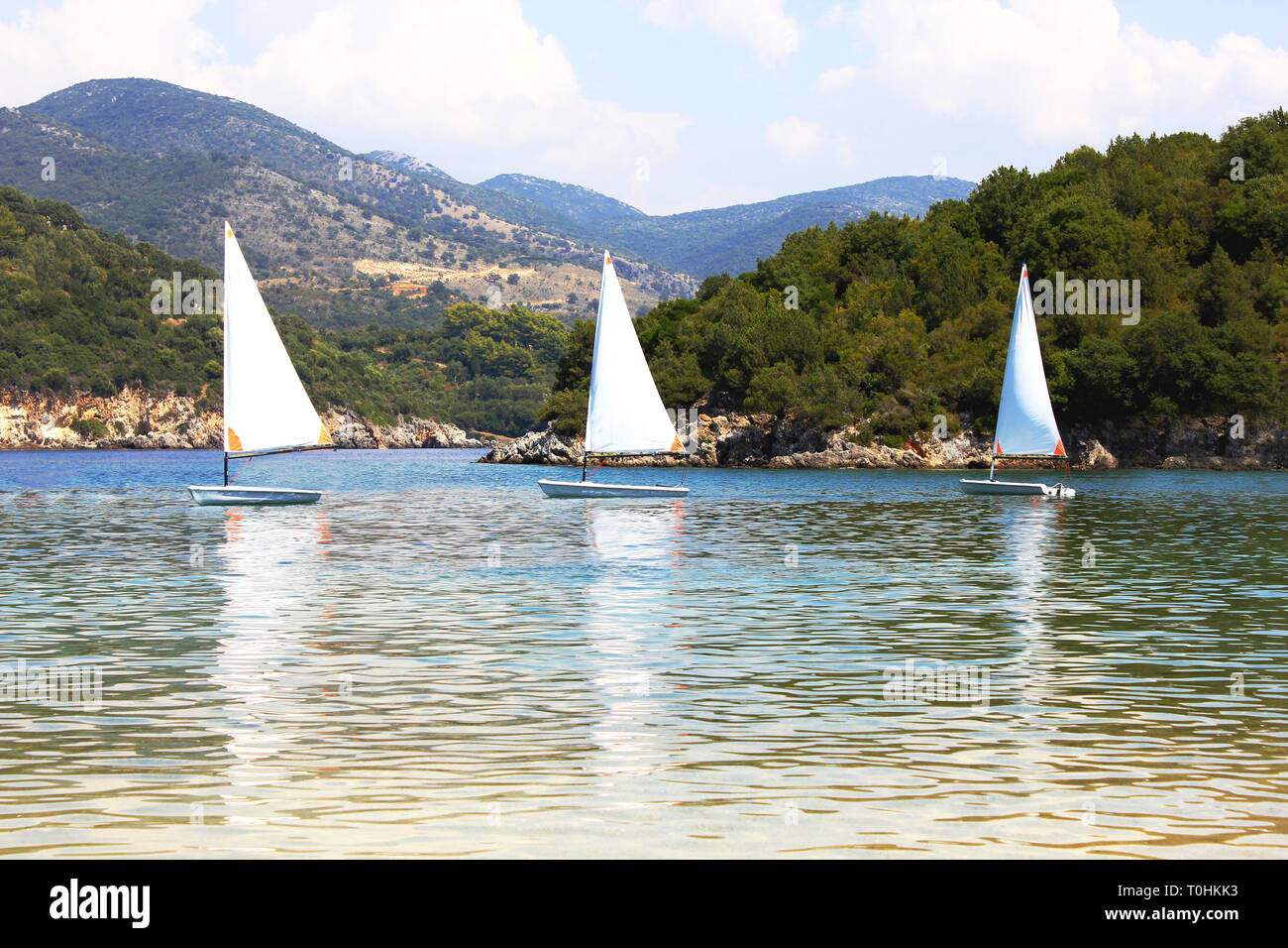 Small sail boats at Bella Vraka beach. Syvota, Greece Stock Photo - Alamy