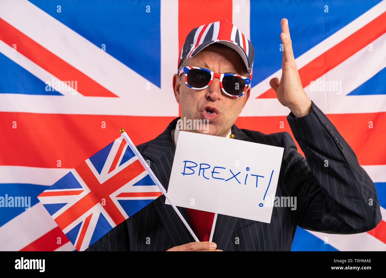 British male businessman with Brexit banner and UK flag Stock Photo