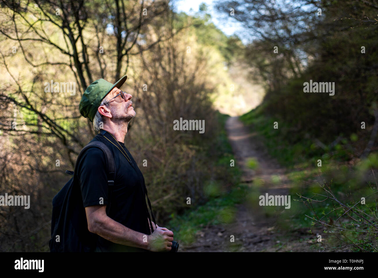 Senior man enjoying nature on a hiking trip Stock Photo