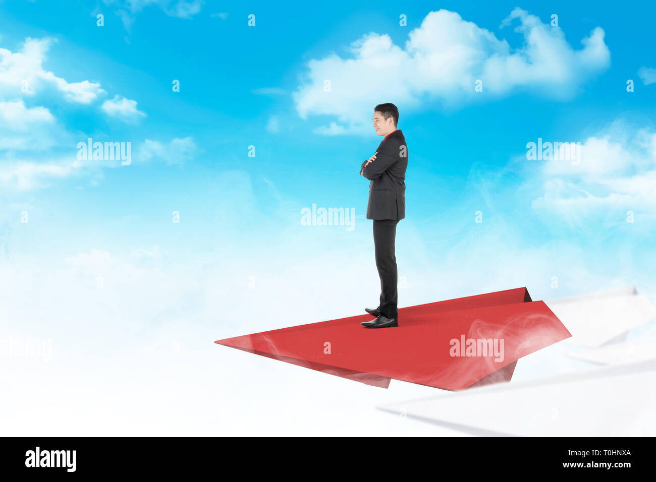 Handsome asian businessman standing on paper plane flying with cloud ...