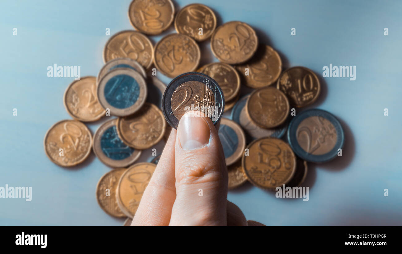 A Human Hand Holds A Penny Above Pile Of Two And One And 50 Cent Euro Coins Made Of Copper And Nickel Stock Photo Alamy A Human Hand Holds A Penny Above Pile Of Two And One And 50 Cent Euro Coins Made Of Copper And Nickel Stock Photo Alamy