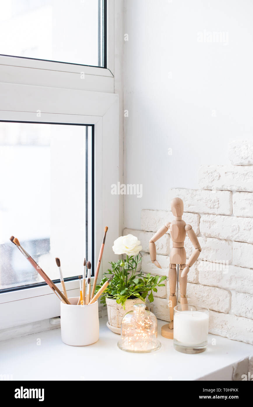 Contemporary Home Decor With Buttercups And Candles On Windowsill