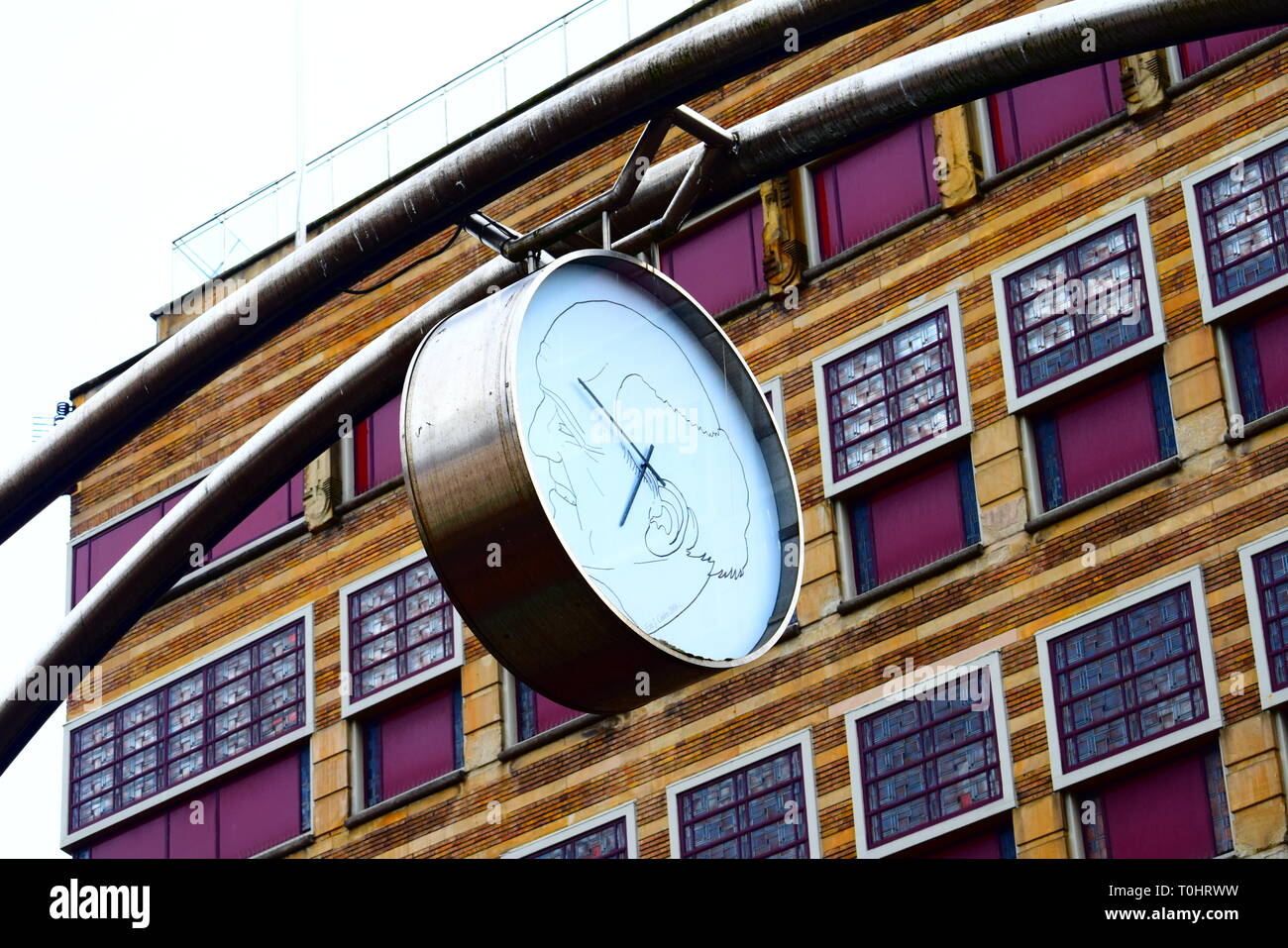 haarlem , netherlands - clock with drawing and purple building background. Stock Photo