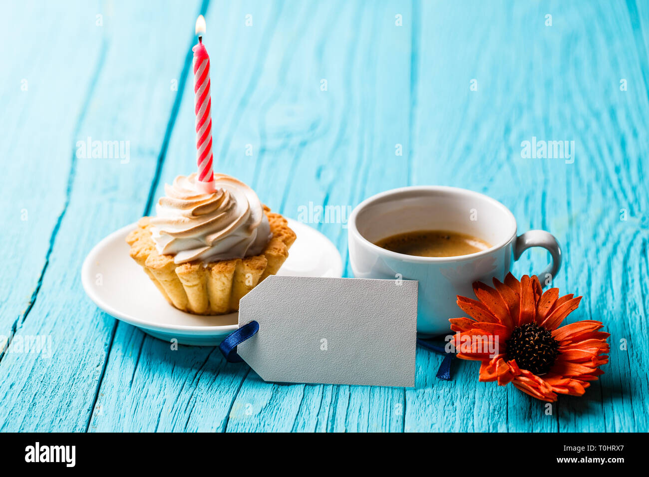 Gerbera, postcard, coffee and cake Stock Photo