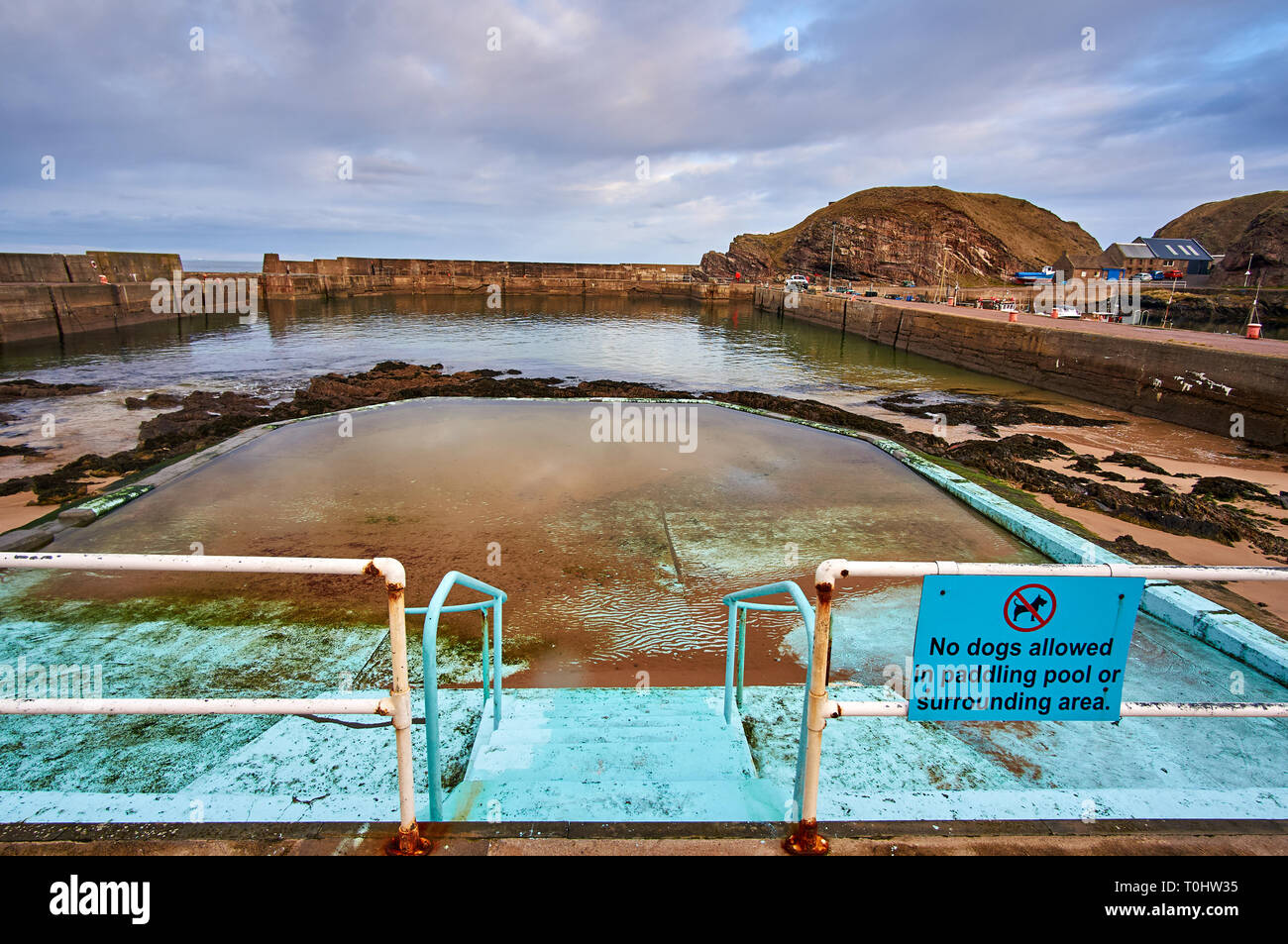 Tidal pool in Portknockie harbour, an old Scottish fishing village located in Moray Firth, UK. Stock Photo