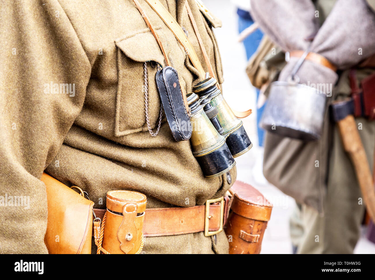 Vintage leather holster, binoculars and other ammunition on the belt