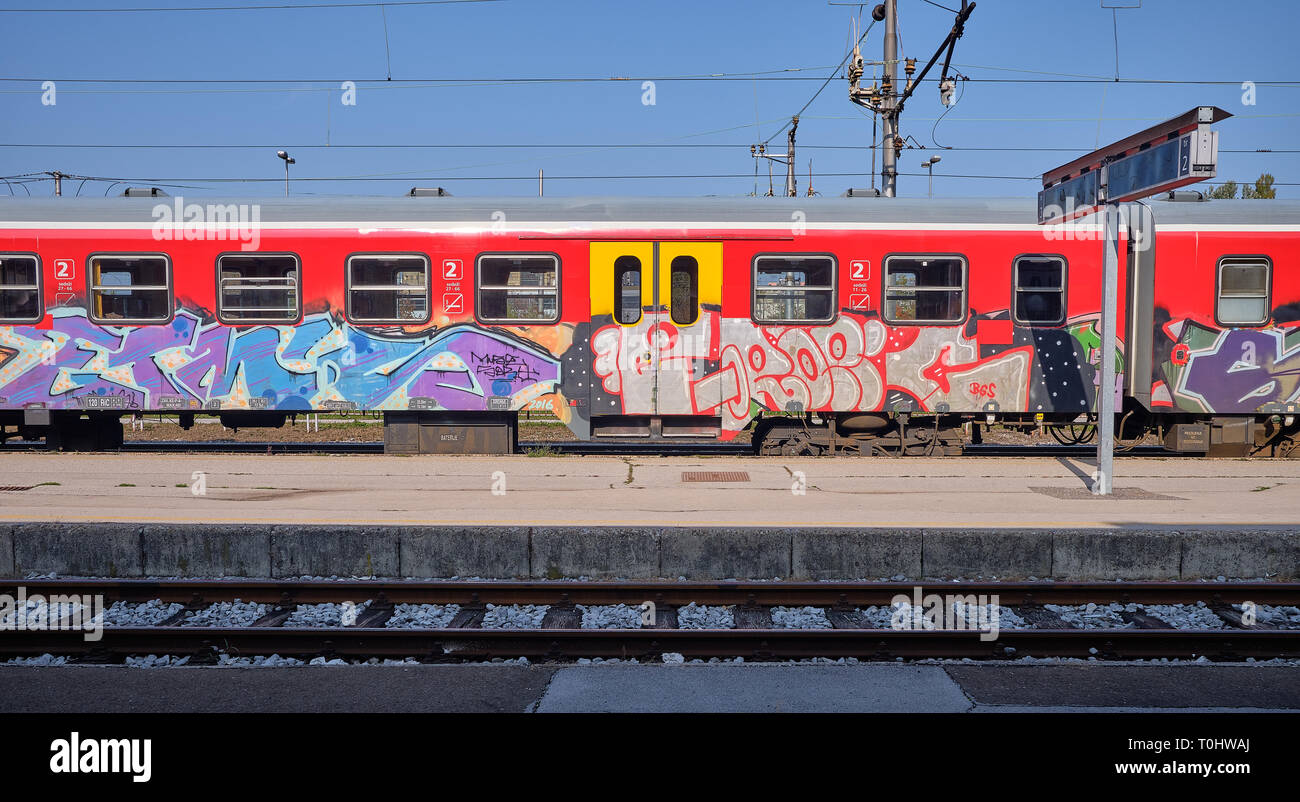 Graffiti covered Slovenian train at platform in Ljubljana train station. Ljubljana, Slovenia Stock Photo