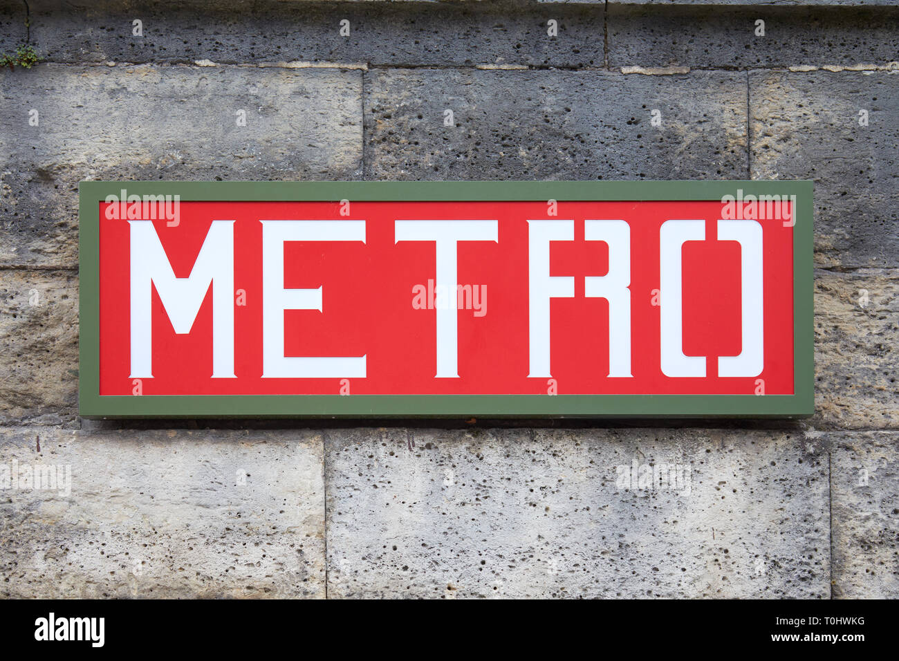 PARIS, FRANCE - JULY 22, 2017: Metro sign red and green on wall in Paris, France. Stock Photo